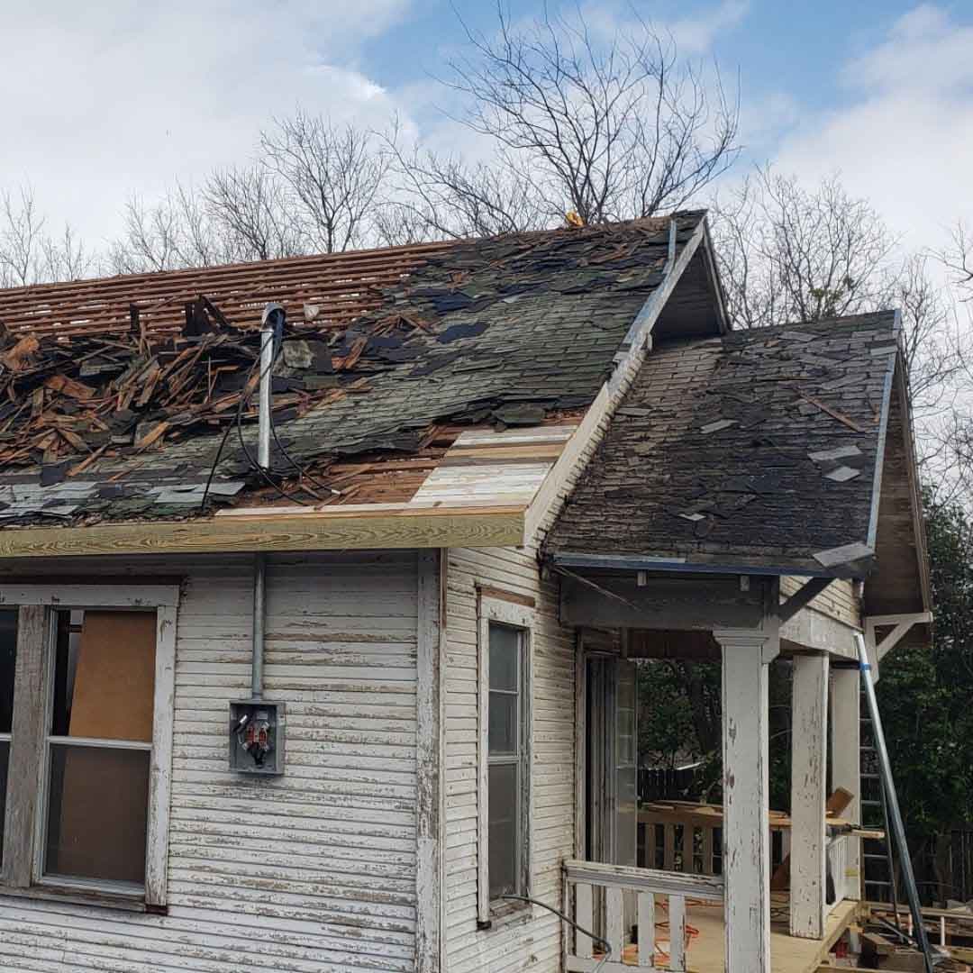 Storm-damaged roof assessed for an insurance claim in Manchaca, TX